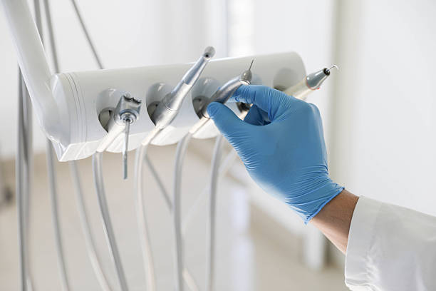 Professional Invisalign Clear Aligners technician working in Cortland West, NY